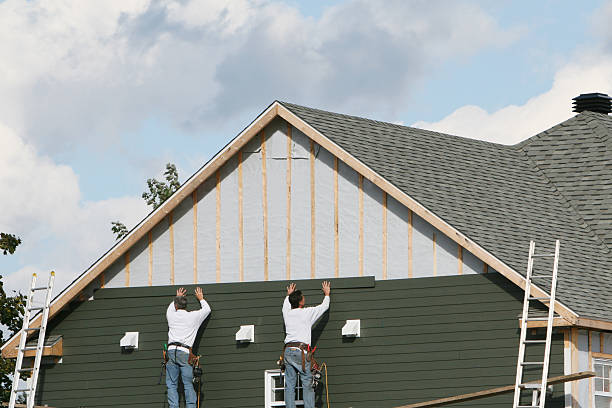 Professional Vinyl Siding technician working in Woburn, MA
